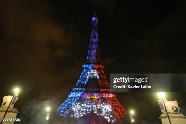 The Effeil Tower trees the two star of the French victory in the world cup. Fans Celebrate France Winning The World Cup 2018 Final Against Croatia at...