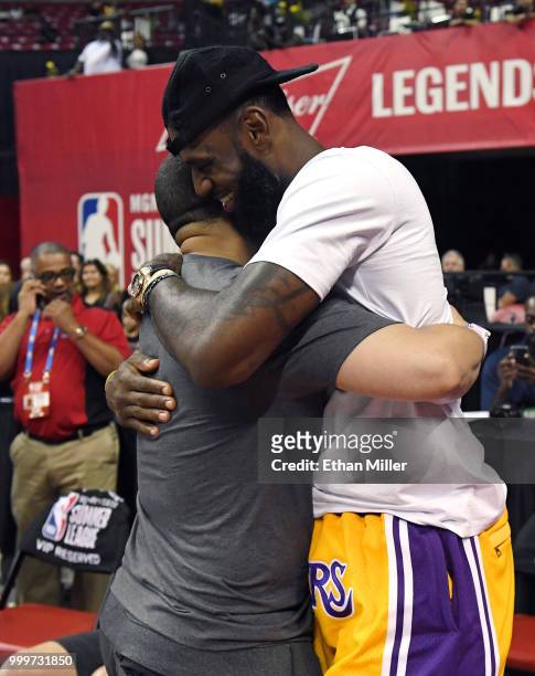 Head coach Tyronn Lue of the Cleveland Cavaliers hugs LeBron James of the Los Angeles Lakers after a quarterfinal game of the 2018 NBA Summer League...