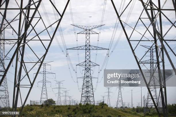 Power lines run through Hydro One Ltd. Transmission towers in Toronto, Ontario, Canada, on Thursday, July 12, 2018. Hydro One is facing a long-term...