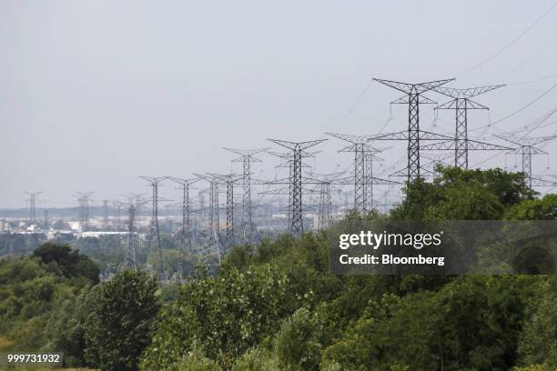 Power lines run through Hydro One Ltd. Transmission towers in Toronto, Ontario, Canada, on Thursday, July 12, 2018. Hydro One is facing a long-term...