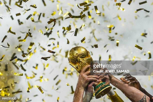 France's players lift the World Cup trophy after winning the Russia 2018 World Cup final football match between France and Croatia at the Luzhniki...