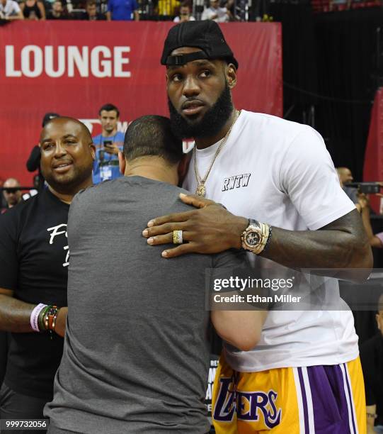 Head coach Tyronn Lue of the Cleveland Cavaliers hugs LeBron James of the Los Angeles Lakers after a quarterfinal game of the 2018 NBA Summer League...