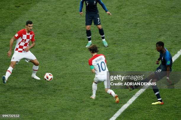 France's midfielder Paul Pogba shoots and scores a goal during the Russia 2018 World Cup final football match between France and Croatia at the...