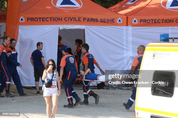 Woman is taken to medical care during during the World Cup final against Croatia, on July 15, 2018 in the Champs de Mars, near the Eiffel Tower...