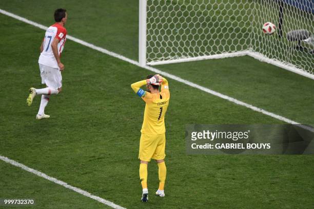 France's goalkeeper Hugo Lloris reacts after Croatia's forward Mario Mandzukic scored during the Russia 2018 World Cup final football match between...