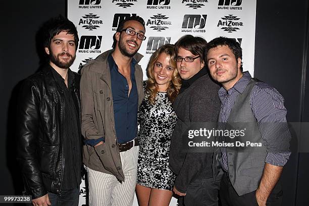 Michelle Edgar and Saen Fitzgerald, Julio Tavarez, Cliff Sarcona and Dan Nigro of As Tall As Lions perform during the first anniversary presentation...