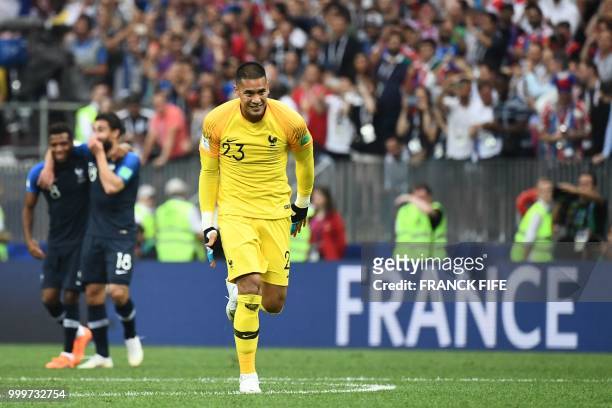 France's goalkeeper Alphonse Areola and teammates celebrate after winning the Russia 2018 World Cup final football match between France and Croatia...