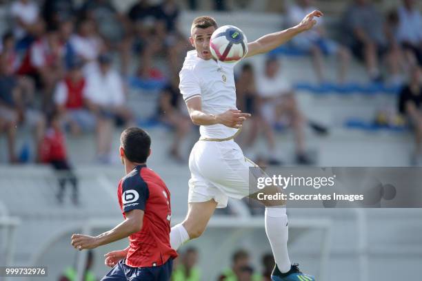 Junior Alonso Mujica of Lille, Remi Oudin of Reims during the Club Friendly match between Lille v Reims at the Stade Paul Debresie on July 14, 2018...