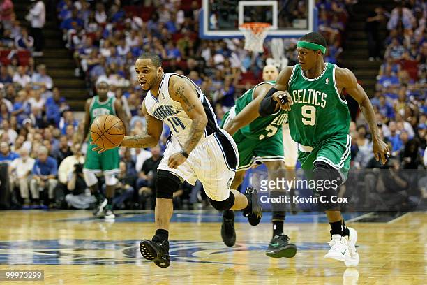 Jameer Nelson of the Orlando Magic brins the ball up court against Rajon Rondo of the Boston Celtics in Game Two of the Eastern Conference Finals...