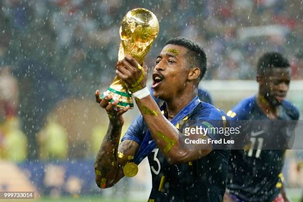 Presnel Kimpembe of France celebrates with the trophy after the 2018 FIFA World Cup Russia Final between France and Croatia at Luzhniki Stadium on...