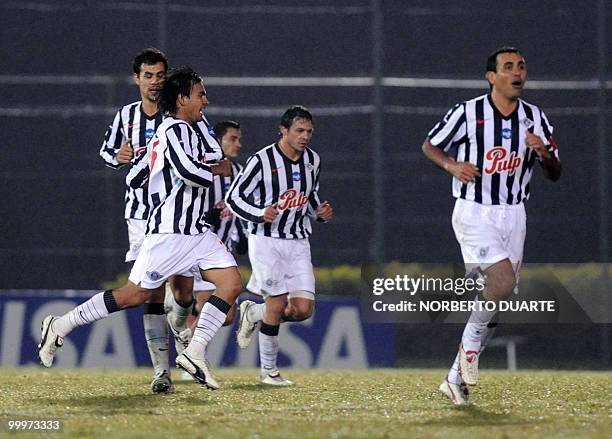 Paraguayan Libertad's players celebrate after scoring a goal against Mexico's Chivas during their Libertadores Cup football match on May 18 at...