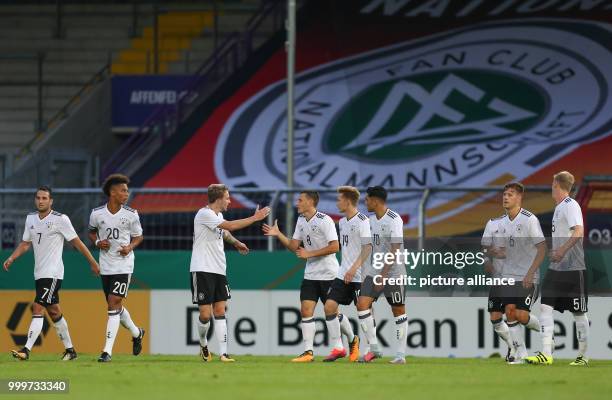 Germany's Maximilian Eggestein celebrates his 1:0 goal with Levin Oeztunali , Thilo Kehrer, Jannes Horn, Johannes Eggestein, Nadiem Amiri, Waldemar...