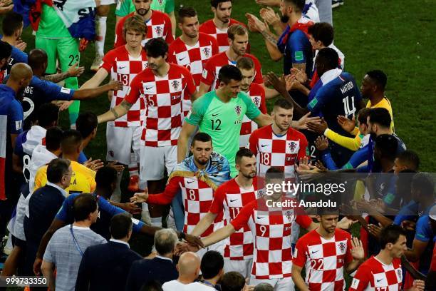 Croatian players shake hands with French players after winning the second place of the FIFA World Cup championship after the 2018 FIFA World Cup...