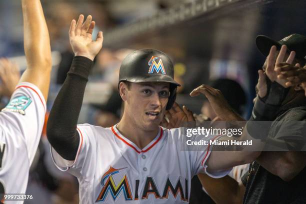Miami Marlins right fielder Brian Anderson celebrates scoring after a sacrifice fly by Miami Marlins catcher J.T. Realmuto during the eighth inning...