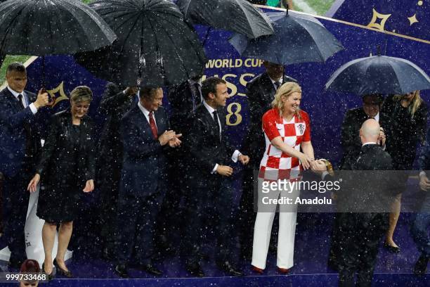 Russian President Vladimir Putin , French President Emmanuel Macron , Croatian President Kolinda Grabar Kitarovic and FIFA President Gianni Infantino...