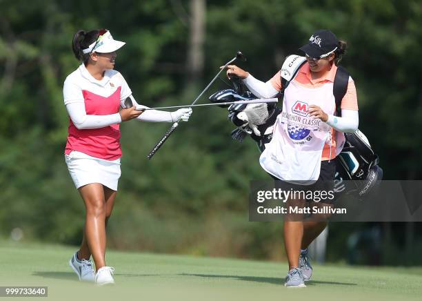 Thidapa Suwannapura of Thailand walks to the green on the 18th hole with her caddie, Nikki Desjubha, during the final round of the Marathon Classic...