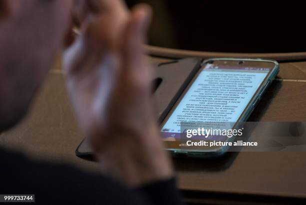 Devoted Jew prays using his smartphone at the Westend Synagogue in Frankfurt/Main, Germany, 5 September 2017. Religious jews from different...