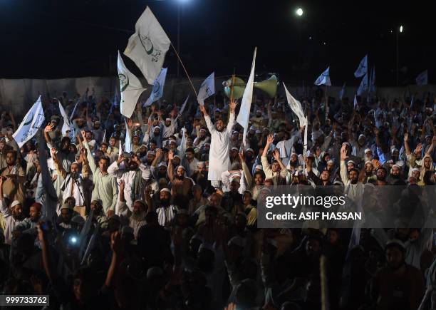 Supporters of Muttahida Majlis-e-Amal , a Pakistani religious parties alliance, gather during an election campaign rally for the upcoming general...