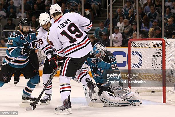 Jonathan Toews of the Chicago Blackhawks scores a second period goal against goaltender Evgeni Nabokov of the San Jose Sharks in Game Two of the...