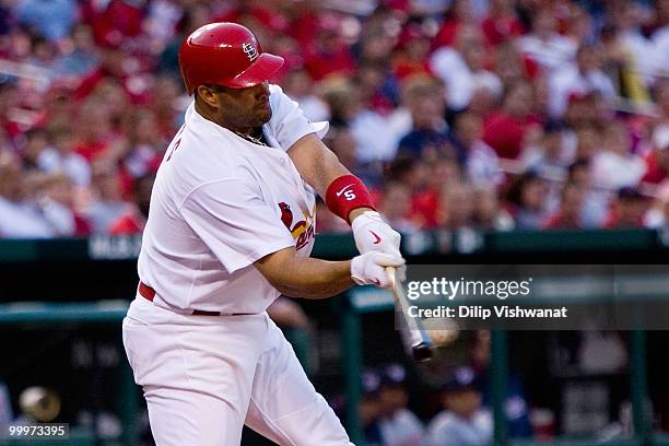 Albert Pujols of the St. Louis Cardinals hits a single against the Washington Nationals at Busch Stadium on May 18, 2010 in St. Louis, Missouri. The...