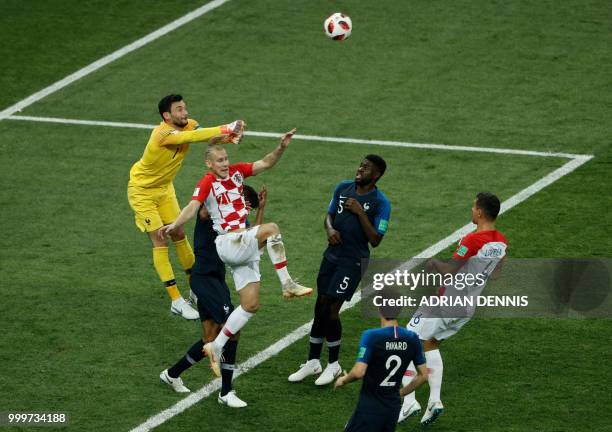 France's goalkeeper Hugo Lloris attempts to make a save during the Russia 2018 World Cup final football match between France and Croatia at the...