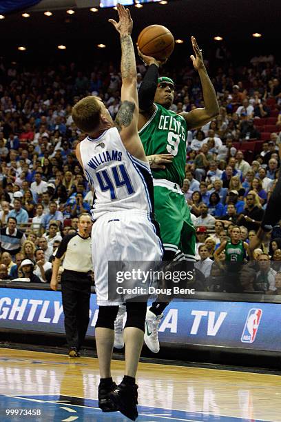 Rajon Rondo of the Boston Celtics drives for a shot attempt against Jason Williams of the Orlando Magic in Game Two of the Eastern Conference Finals...