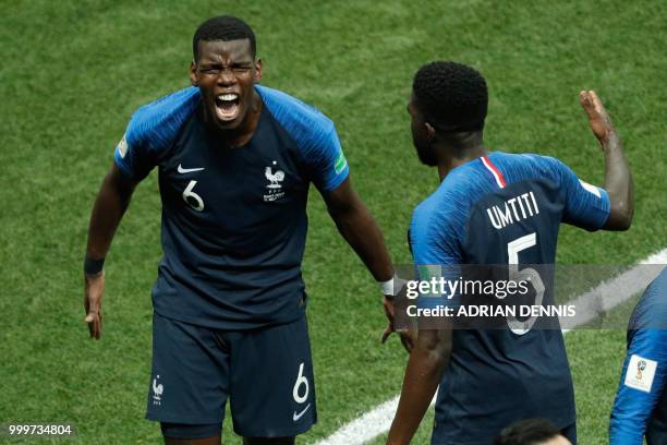 France's midfielder Paul Pogba celebrates with teammates after scoring a goal during the Russia 2018 World Cup final football match between France...