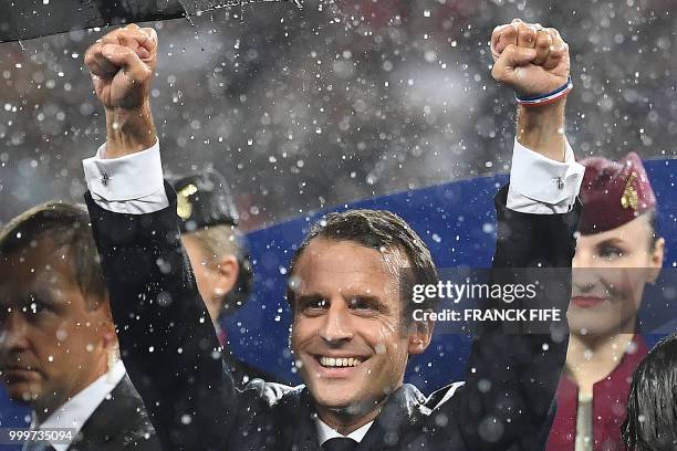 French President Emmanuel Macron celebrates during the trophy ceremony at the end of the Russia 2018 World Cup final football match between France...