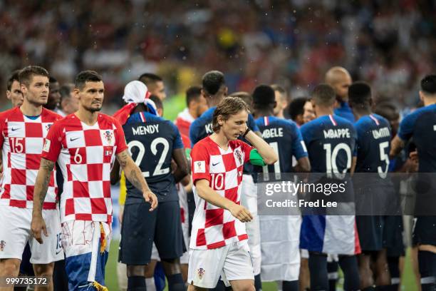 Luka Modric of Croatia walks off with the FIFA Golden Ball for player of the tournament at the end of the 2018 FIFA World Cup Russia Final between...