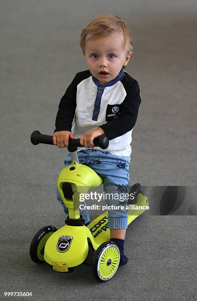 Lion sits on a Highwaykick 1 scooter at the Child & Youth trade fair in Cologne, Germany, 6 September 2017. A record number of companies - around...