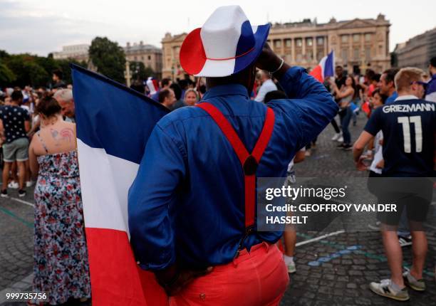 France supporters celebrate on Place de la Concorde in Paris on July 15 after France won the Russia 2018 World Cup final football match between...