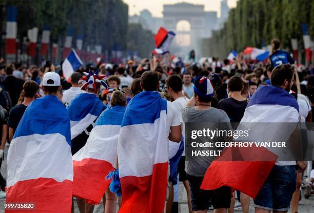 France supporters celebrate on Place de la Concorde in Paris on July 15 after France won the Russia 2018 World Cup final football match between...