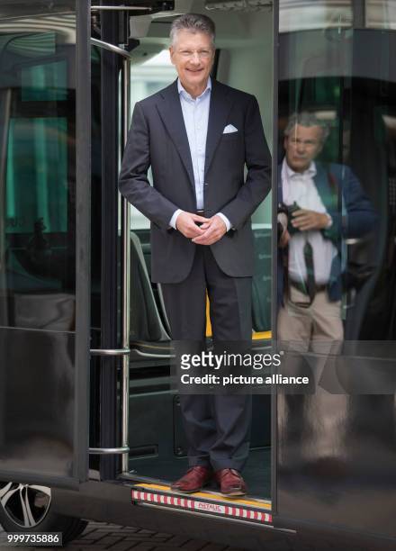 Elmar Degenhart, the CEO of Continental AG, stands in the doorway of the company's new Cube e-taxi in Frankfurt am Main, Germany, 6 September 2017....