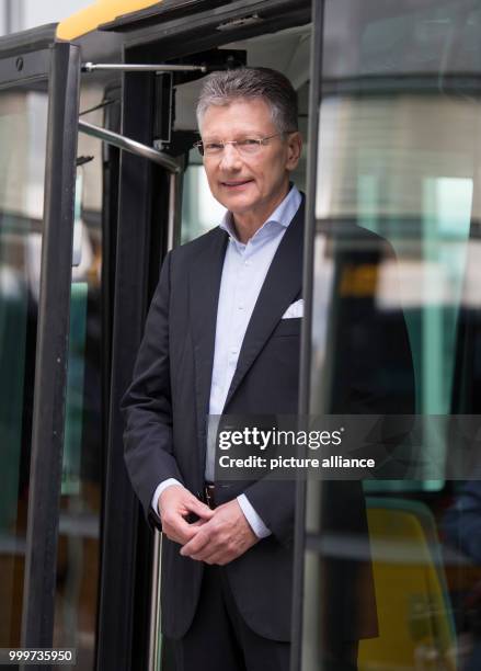 Elmar Degenhart, the CEO of Continental AG, stands in the doorway of the company's new Cube e-taxi in Frankfurt am Main, Germany, 6 September 2017....