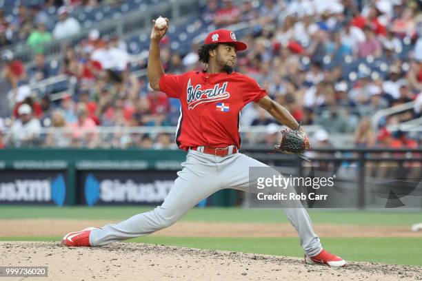 Adonis Medina of the World Team pitches in the seventh inning against the U.S. Team during the SiriusXM All-Star Futures Game at Nationals Park on...