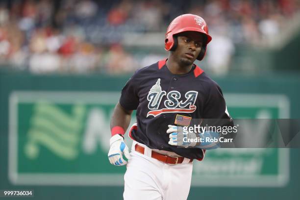 Taylor Trammell of the Cincinnati Reds and the U.S. Team rounds the bases after hitting a solo home run in the sixth inning against the World Team...