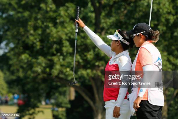 Thidapa Suwannapura, of Thailand, lines up her birdie put on the 18th green during a playoff hole during the final round of the LPGA Marathon Classic...