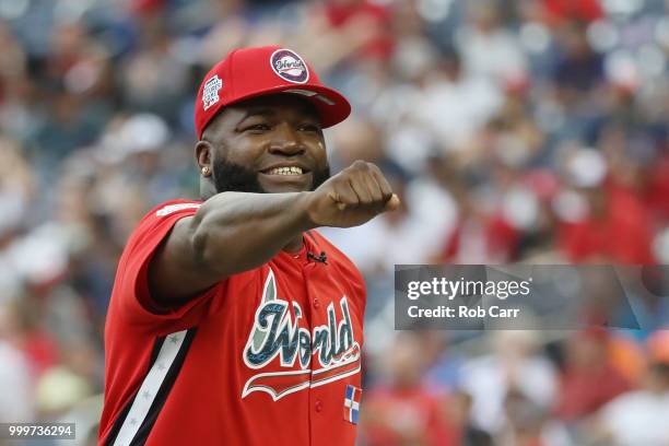 Manager David Ortiz of the World Team celebrates against the U.S. Team during the SiriusXM All-Star Futures Game at Nationals Park on July 15, 2018...