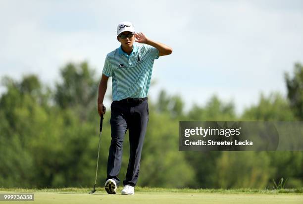 Michael Kim reacts after making a putt on the 16th green during the final round of the John Deere Classic at TPC Deere Run on July 15, 2018 in...