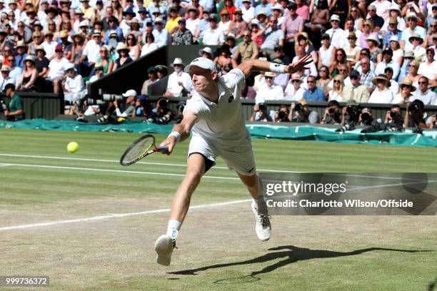 Mens Singles Final - Novak Djokovic v Kevin Anderson - Kevin Anderson stretches for the ball at All England Lawn Tennis and Croquet Club on July 15,...