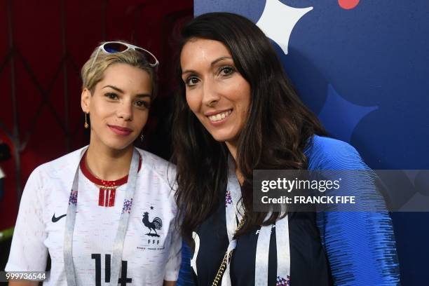 Jennifer , the wife of France's forward Olivier Giroud, poses with Isabelle, wife of France's midfielder Blaise Matuidi, during the Russia 2018 World...