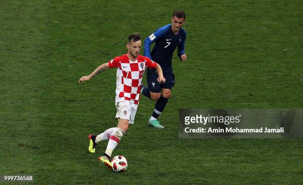 Mario Mandzukic of Croatia and Antoine Griezmann in action during the 2018 FIFA World Cup Russia Final between France and Croatia at Luzhniki Stadium...