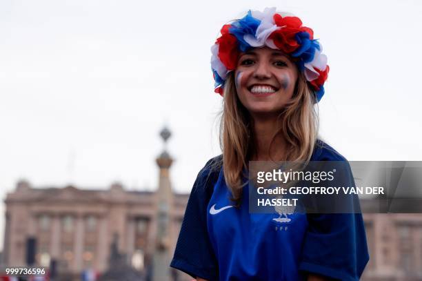 Woman celebrates on Place de la Concorde in Paris on July 15 after France won the Russia 2018 World Cup final football match between France and...