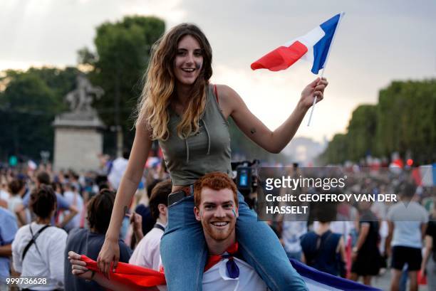 France supporters celebrate on Place de la Concorde in Paris on July 15 after France won the Russia 2018 World Cup final football match between...