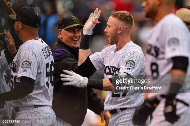 Trevor Story and manager Bud Black of the Colorado Rockies celebrate a ninth-inning walk-off home run by Story and a 4-3 win over the Seattle...