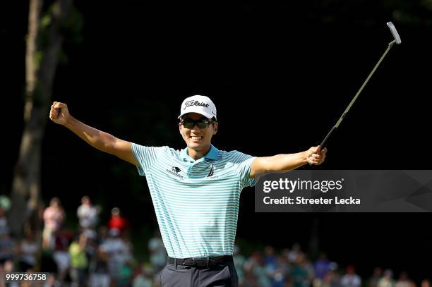 Michael Kim celebrates on the 18th green after winning the John Deere Classic at TPC Deere Run on July 15, 2018 in Silvis, Illinois.