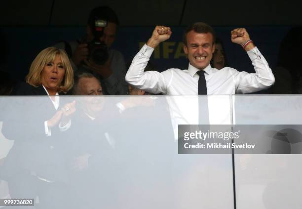 French President Emmanuel Macron and his wife Brigitte Macron react to the victory of French team during the 2018 FIFA World Cup Final at Luzhniki...