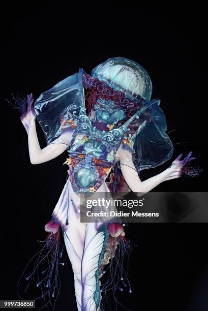 Model, painted by bodypainting artist Hoyam Hajlaoui from Belgium, poses for a picture at the 21st World Bodypainting Festival 2018 on July 14, 2018...