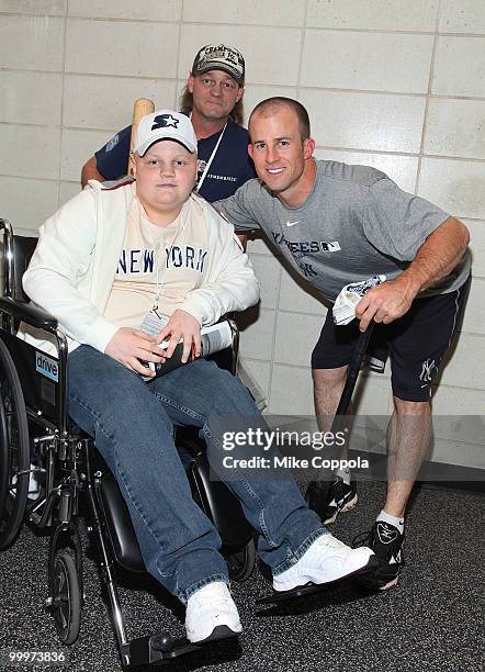 Jack Williams, Roger Williams, and New York Yankees outfielder Brett Gardner pose for pictures at the starter event at NY Yankees batting practice at...