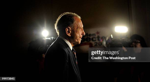 Surrounded by media, U.S. Senator Arlen Specter walks around the empty of supporters party space at the Sheraton Philadelphia City Center ballroom,...